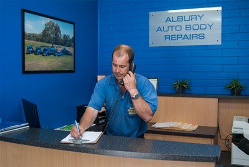Man Using The Phone — Auto Body Repairs in South Albury, NSW