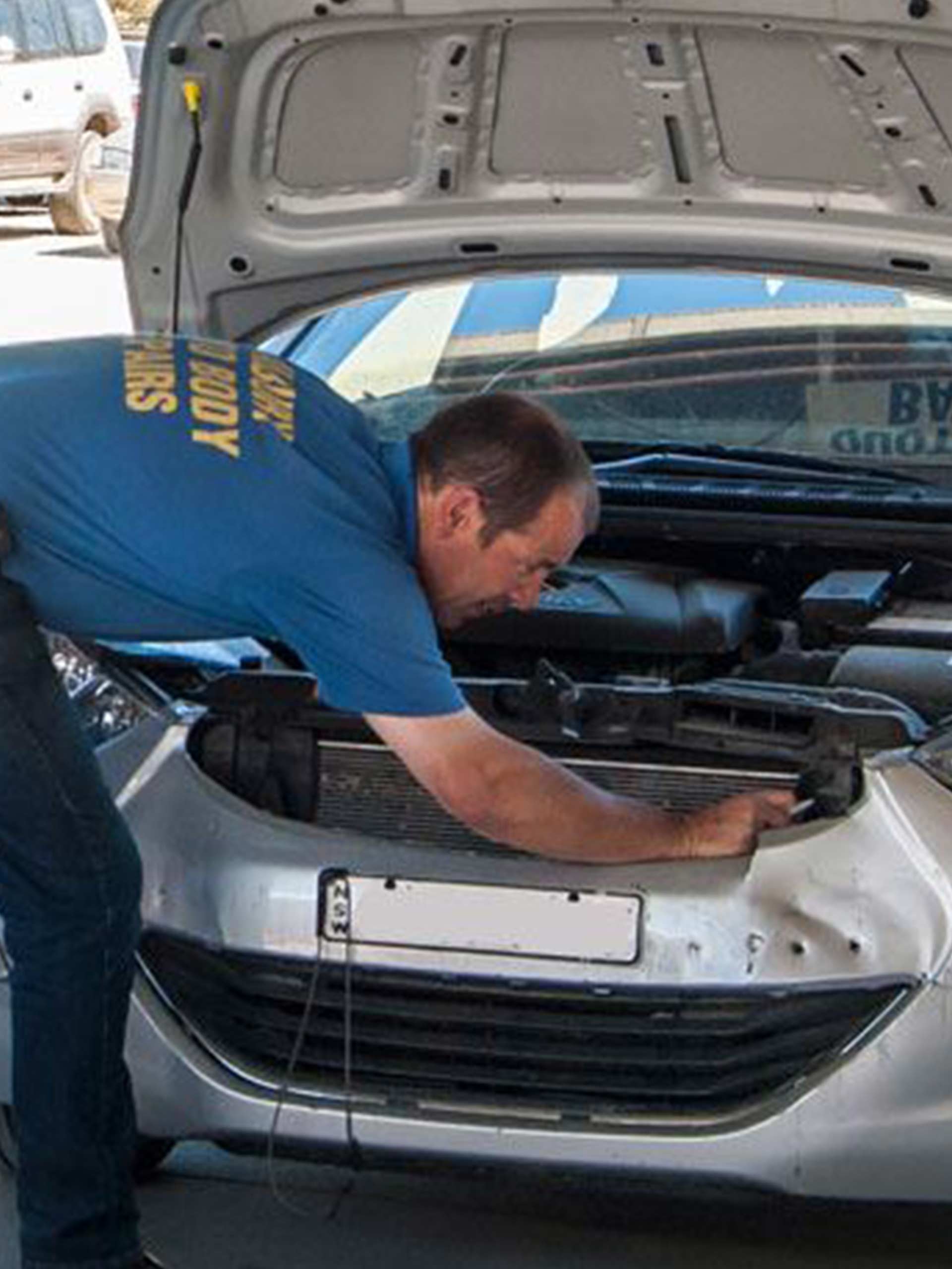 Man Checking The Body Of The Car — Auto Body Repairs in South Albury, NSW