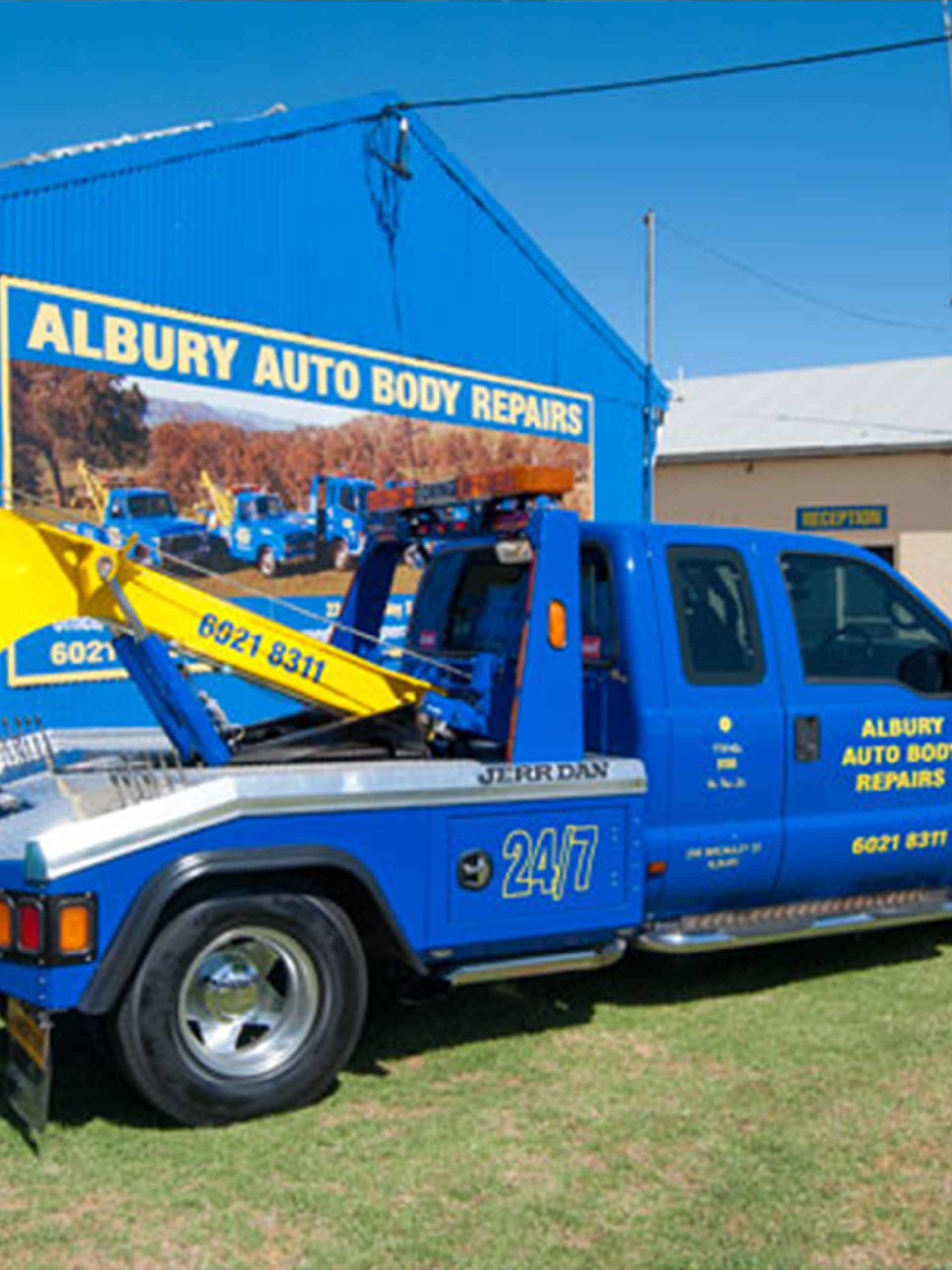 Pick-up Tow Truck — Auto Body Repairs in South Albury, NSW