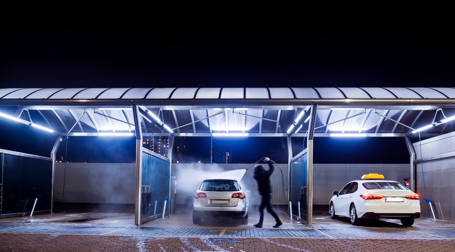 A Man Is Washing A Car | Grapevine, TX | Driven by Detail