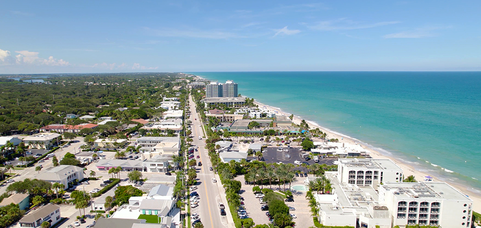 An aerial view of a city next to the ocean.
