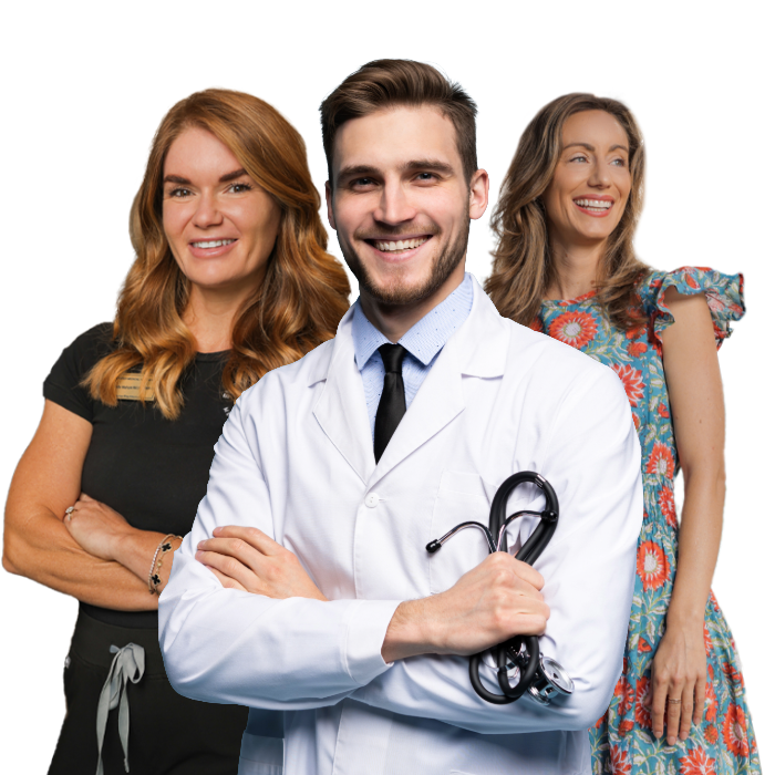 Doctor with stethoscope, smiling, flanked by two smiling women.