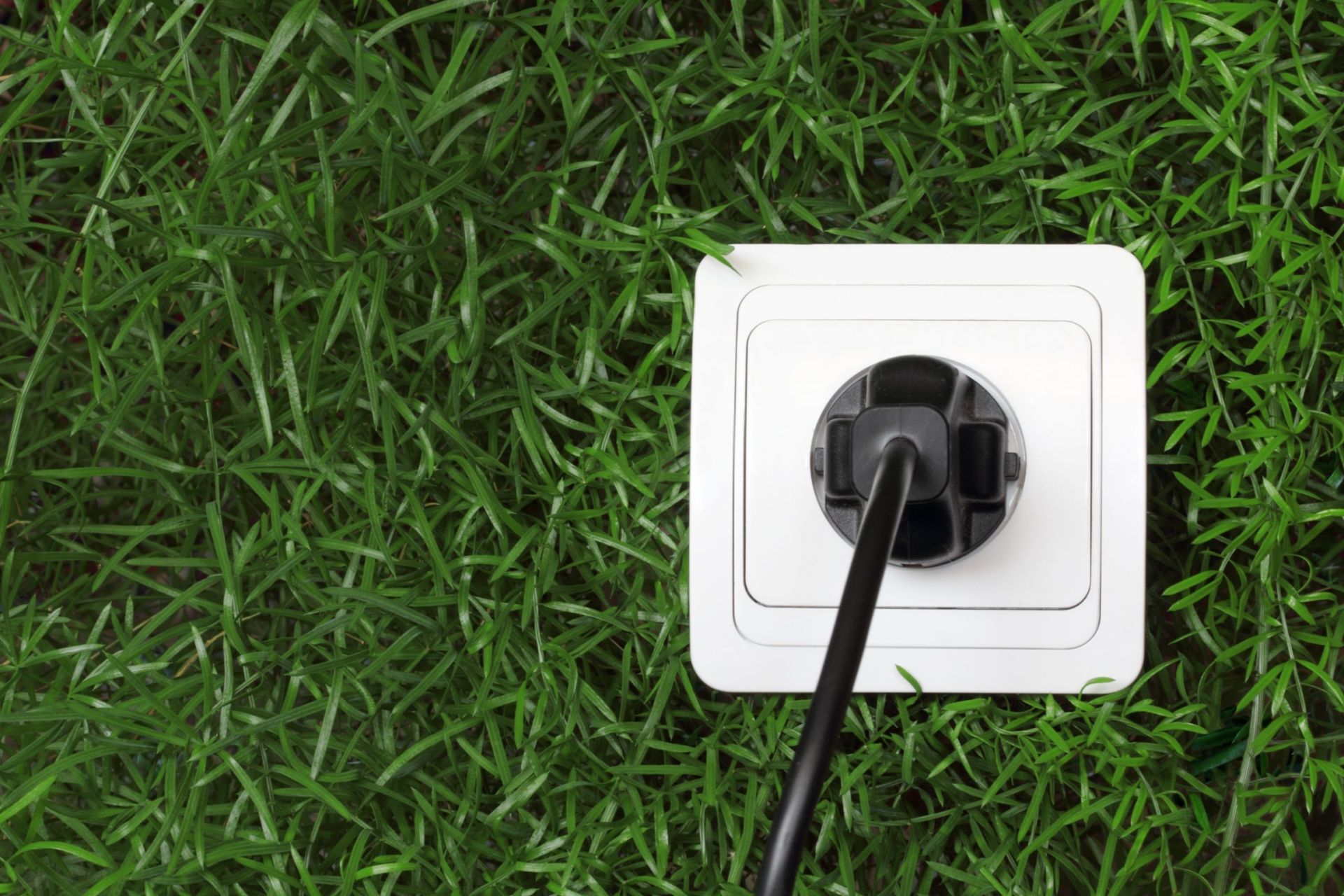 Looking through the vents of an AC unit a fan blade stays motionless