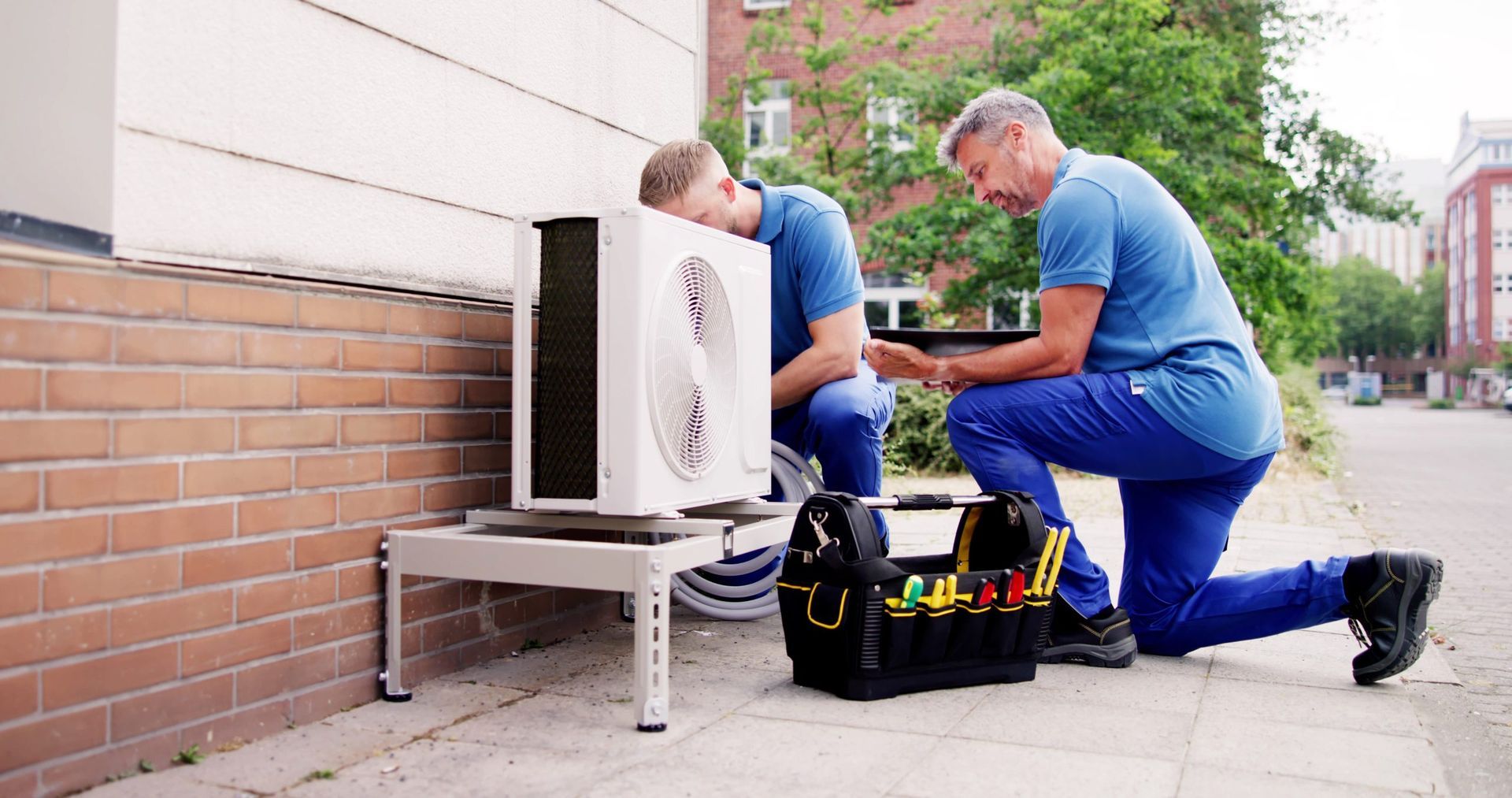 Looking through the vents of an AC unit a fan blade stays motionless
