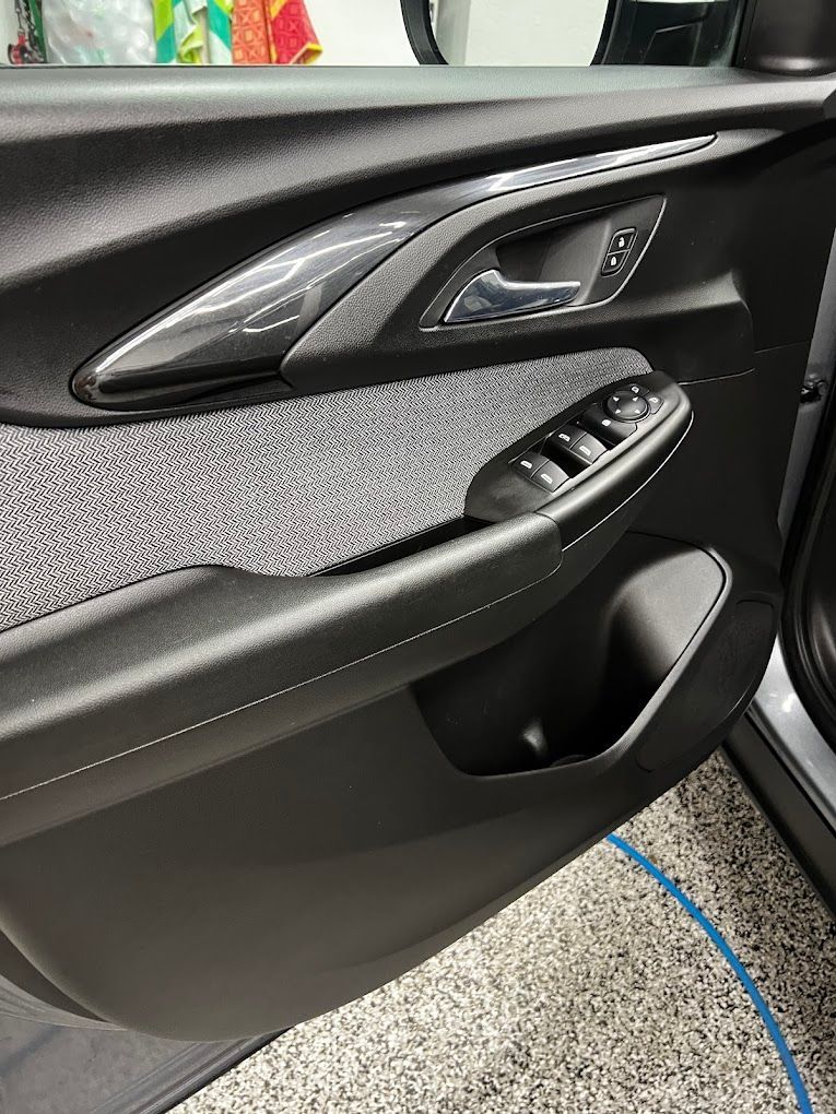 A close up of the door handle of a car.