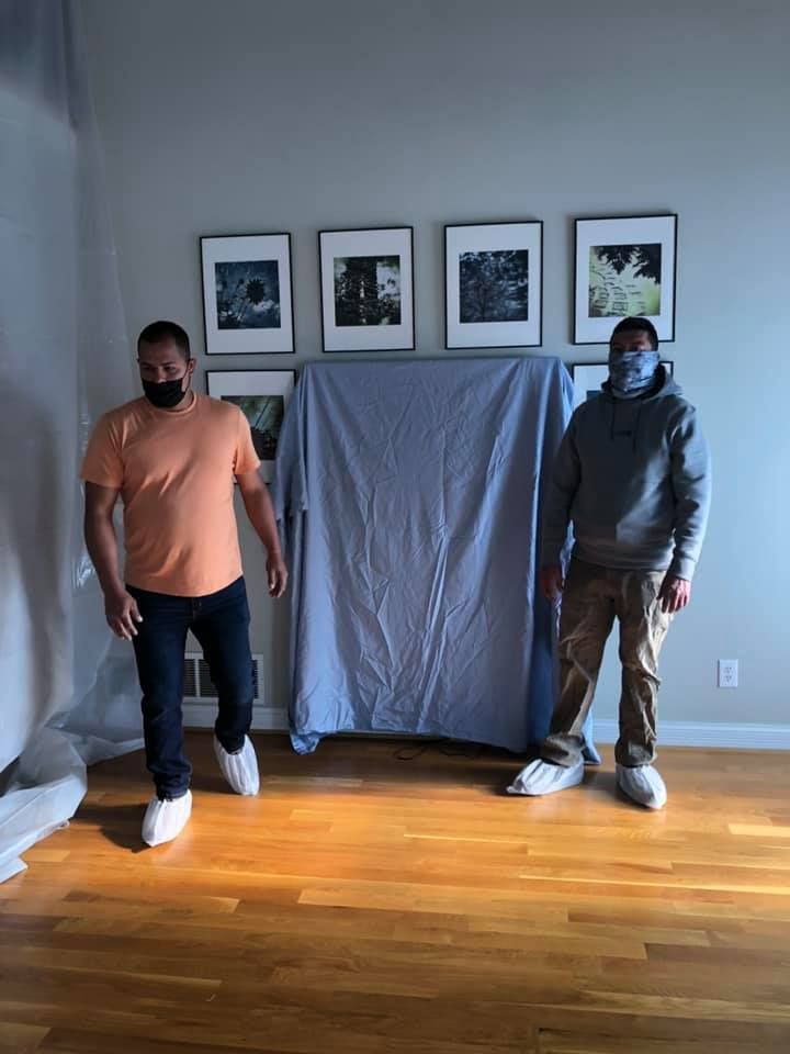 Two Man Covering Items of Furniture For Preparing To Work | Sellersburg, IN | Turnkey Builders