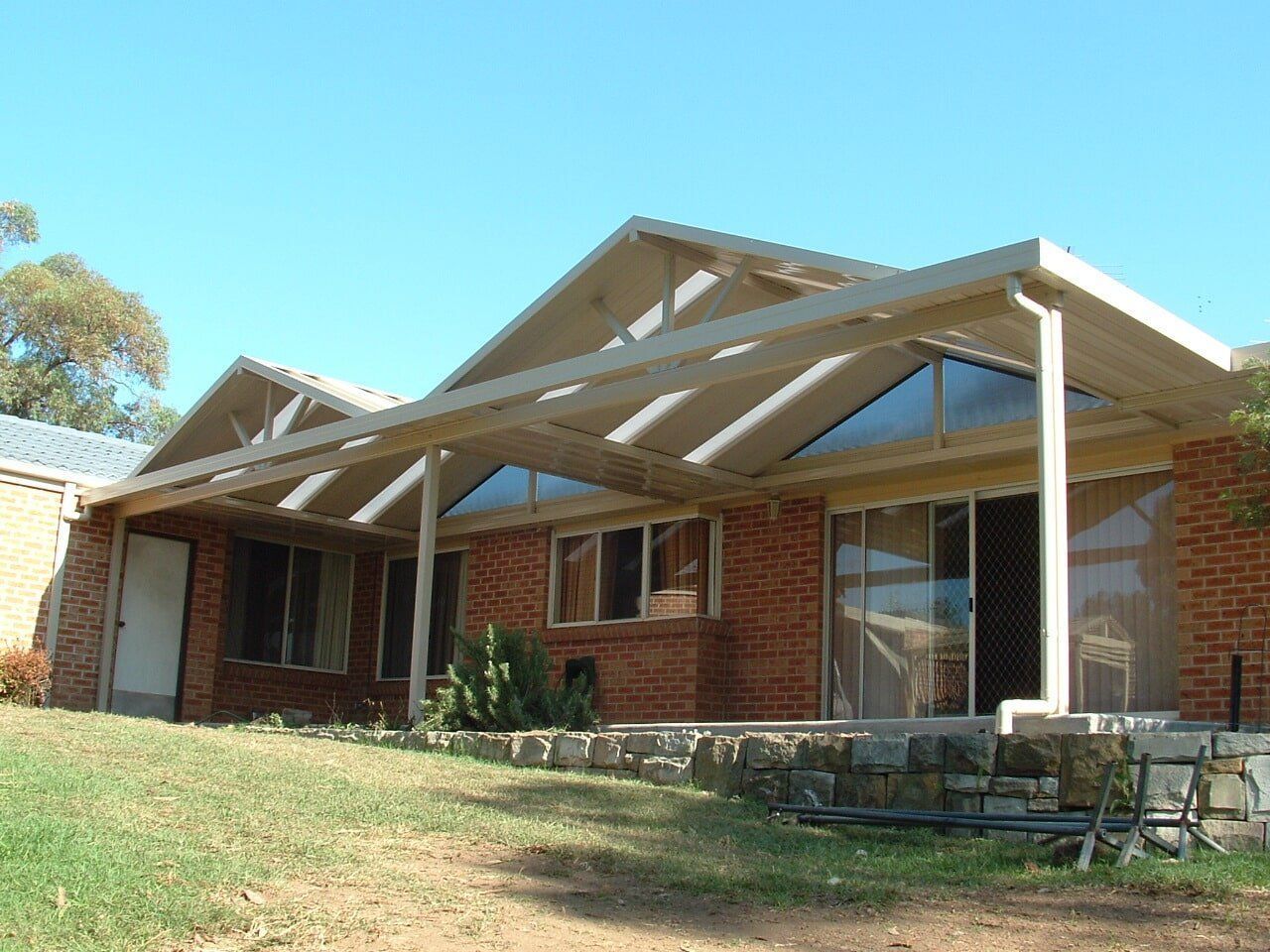 An Aerial View of a Residential Area Next to a Body of Water — Hunter & Mid Coast Patios In Forster-Tuncurry, NSW
