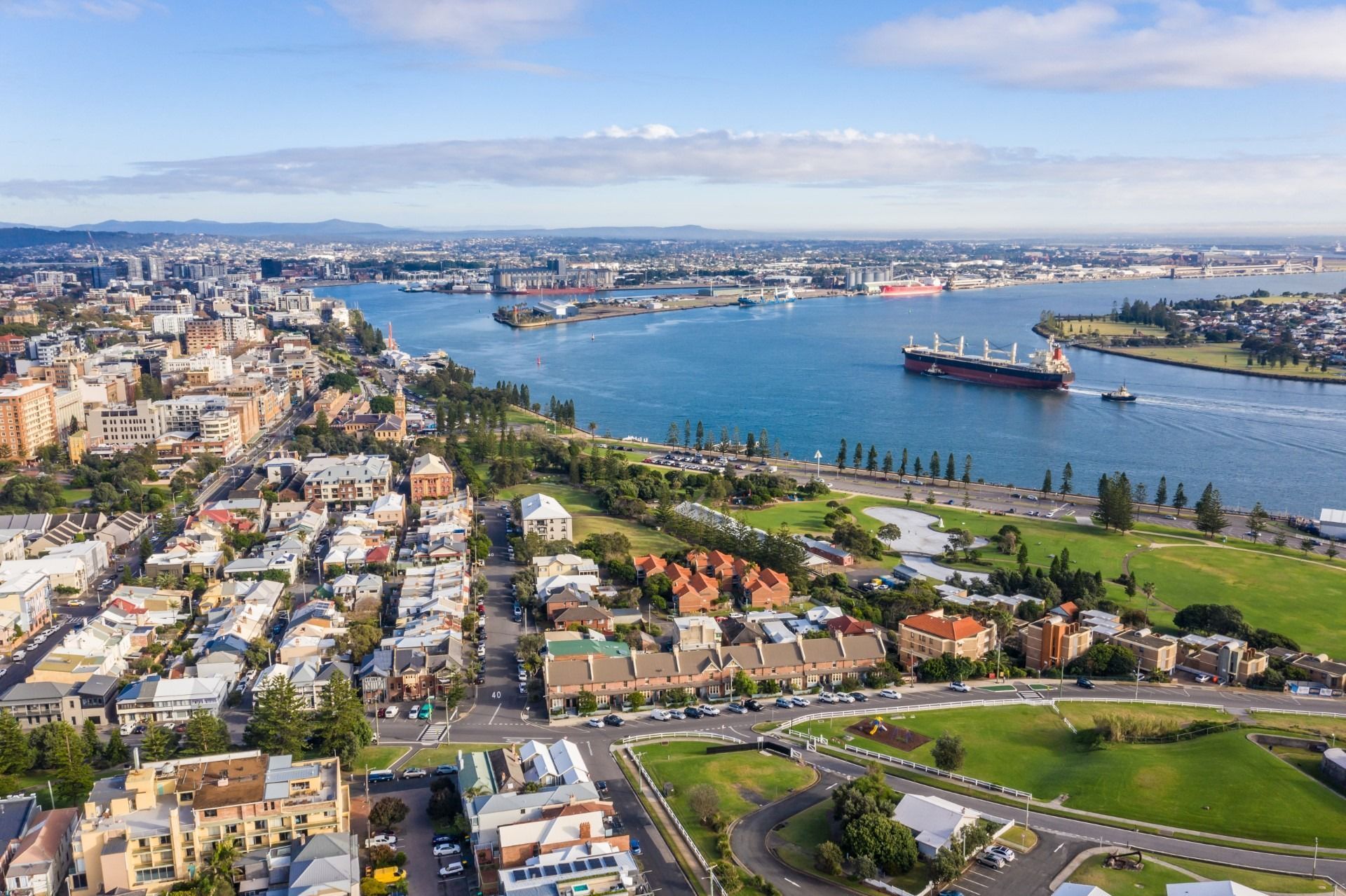 An Aerial View of a Residential Area Next to a Body of Water — Hunter & Mid Coast Patios In Newcastle, NSW