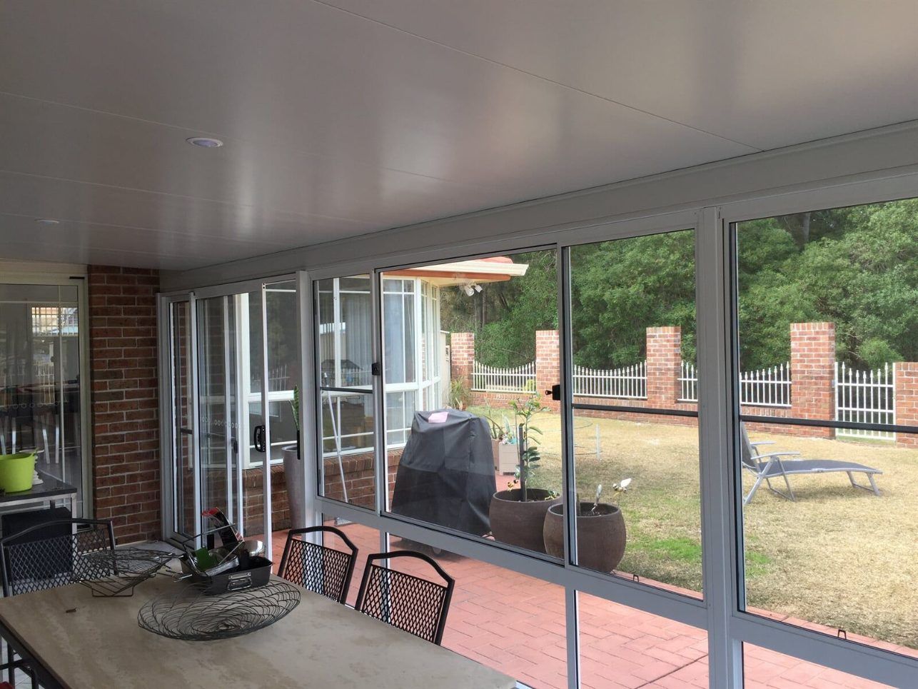 A House With a Large Deck and Stairs Leading Up to It — Hunter & Mid Coast Patios In Forster-Tuncurry, NSW