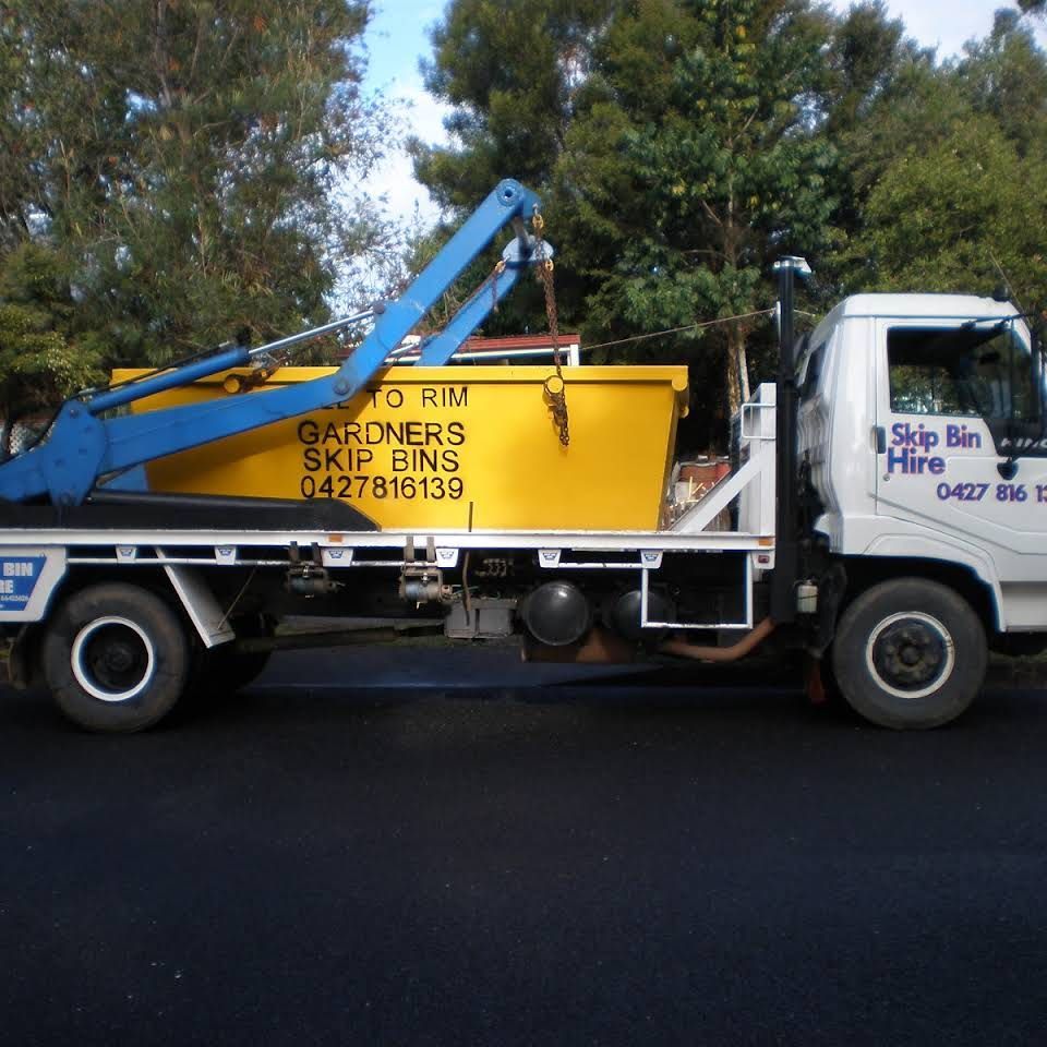 Heavy Industrial Yellow Rubbish Skip On Driveway — Gardners Yamba Skip Bin Hire In South Grafton, NSW