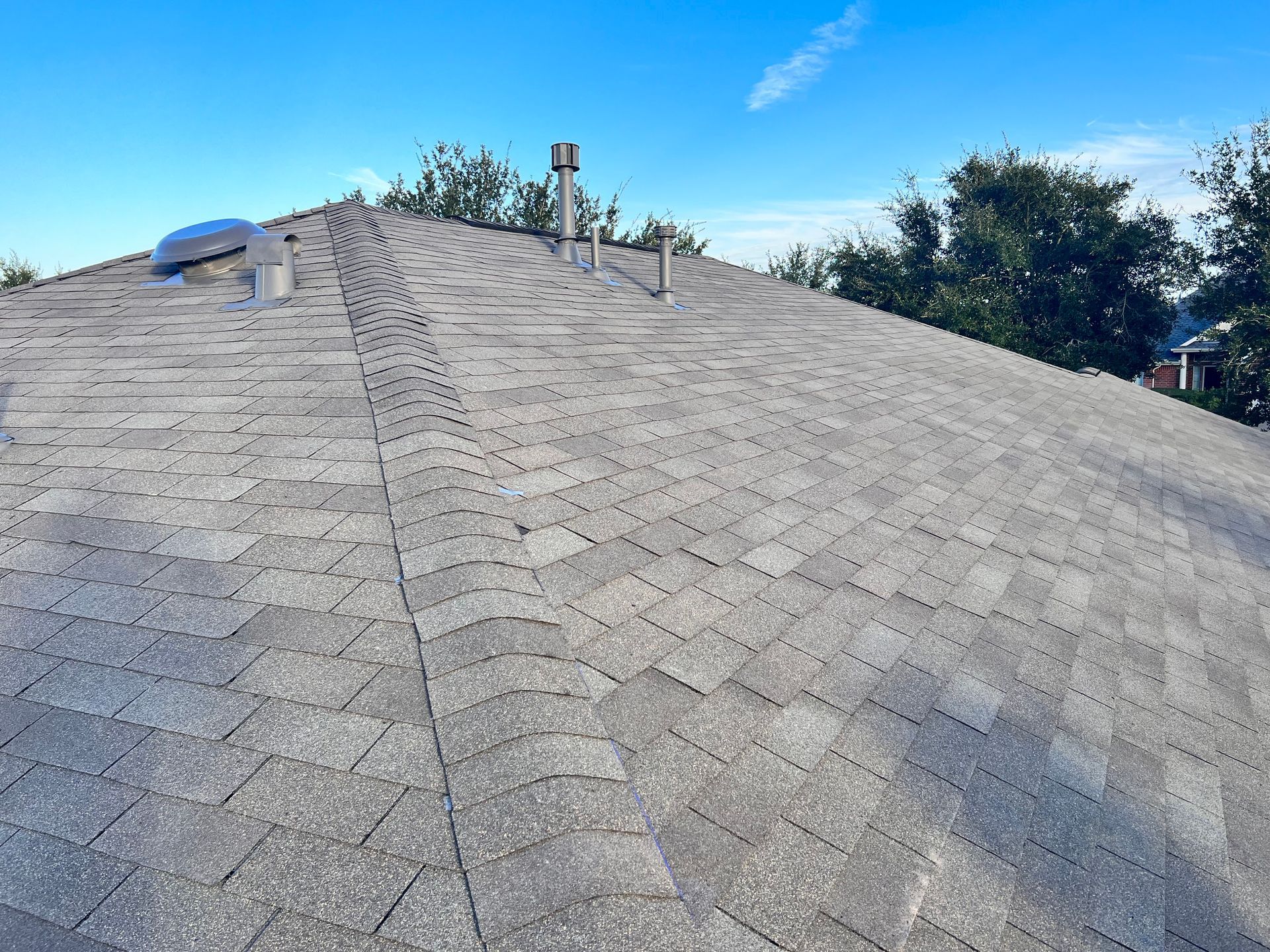 Gray shingled roof replacement
