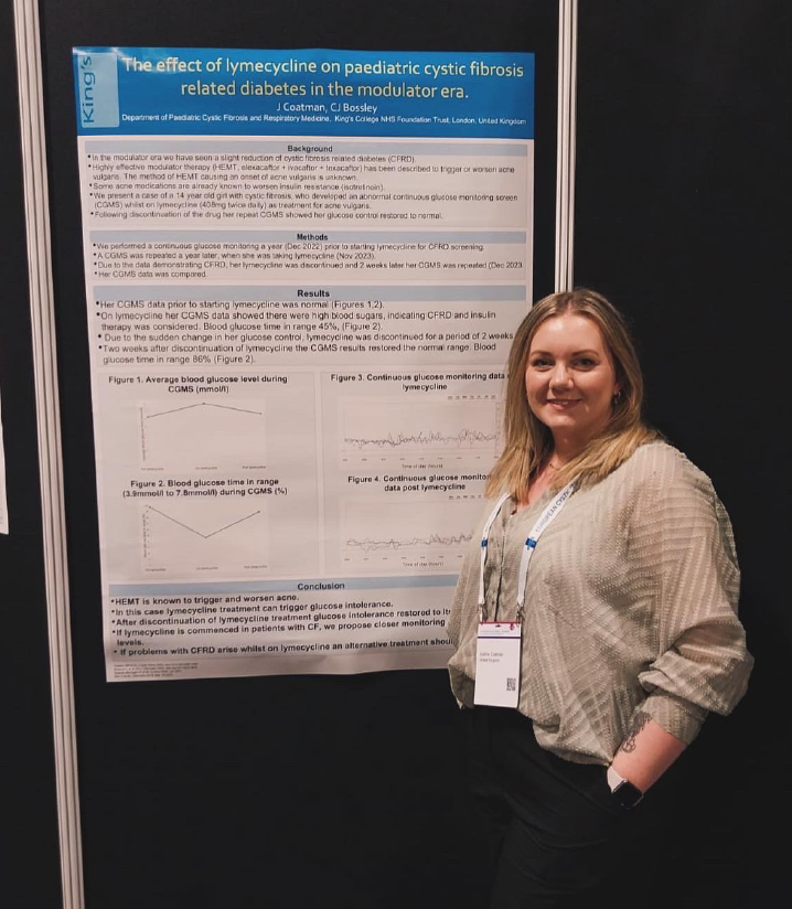 A CFNA nurse standing in front of a poster 