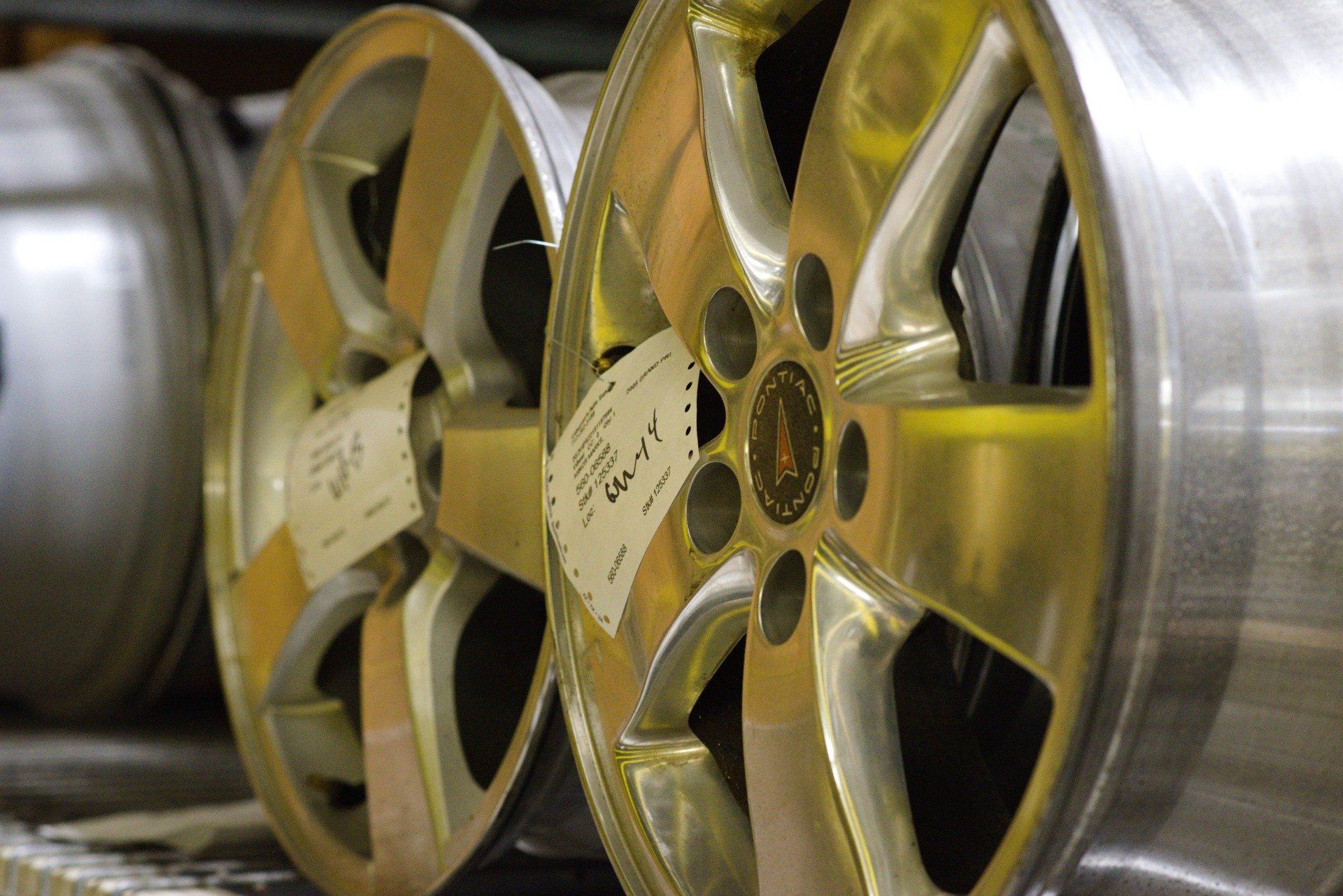 car mechanic repairs breakes from vehicle in a workshop