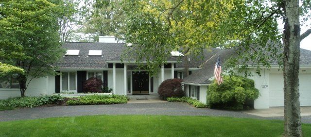 Michigan — Residential House with Country Flag in Muskegon, MI