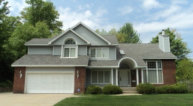 New Roofs — House with Gray Shingle Roofing in Muskegon, MI
