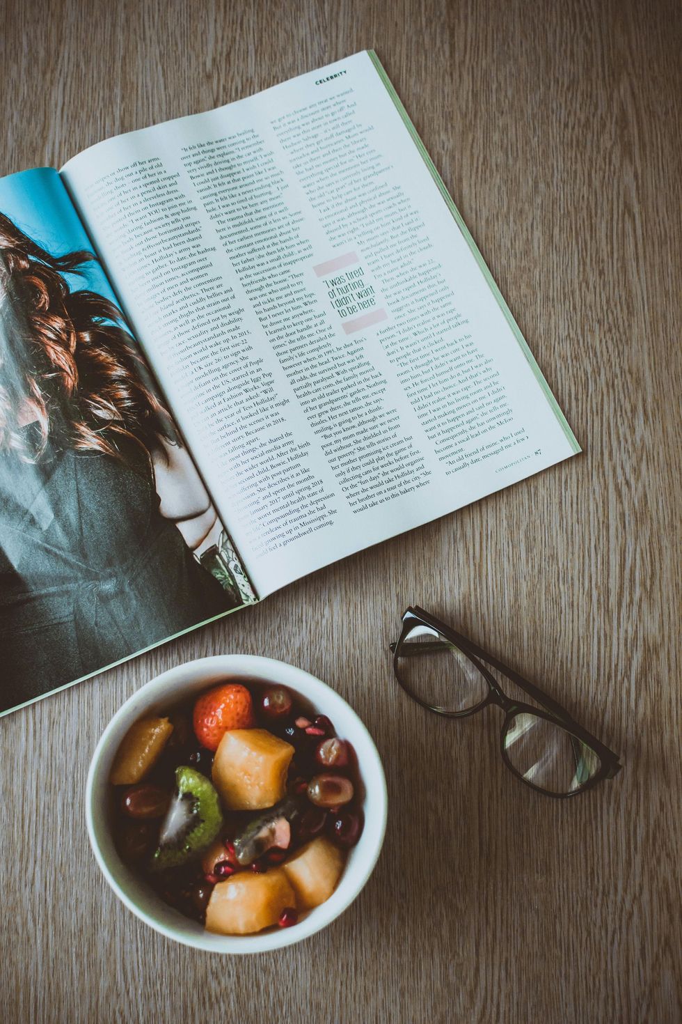 A magazine open to a feature story on a table