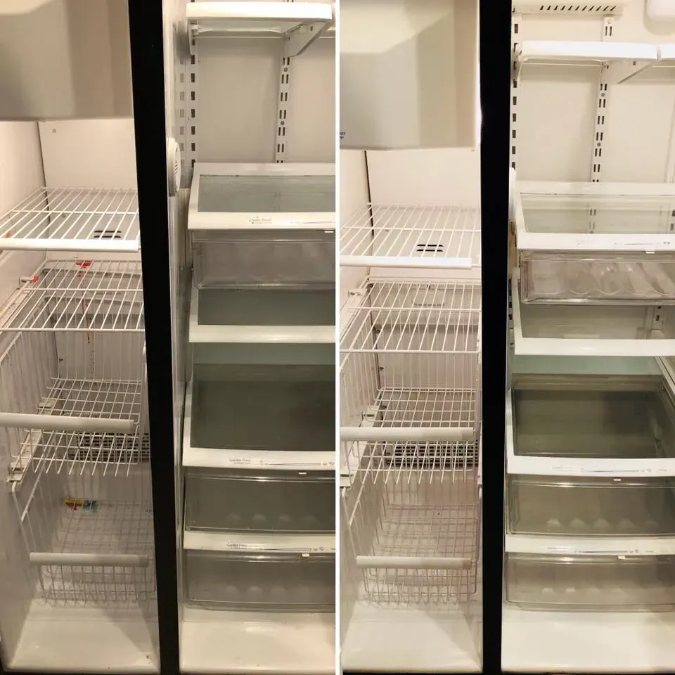 Empty refrigerator interior with wire shelves and clear drawers.