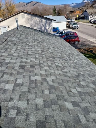 A roof of a house with a lot of shingles on it.