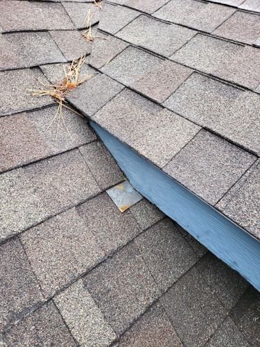 A close up of a roof with a hole in it.
