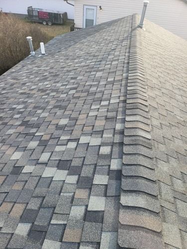 A close up of a roof with shingles on it.