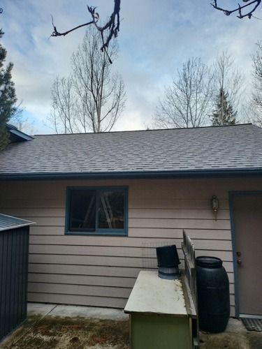 A house with a roof that has shingles on it