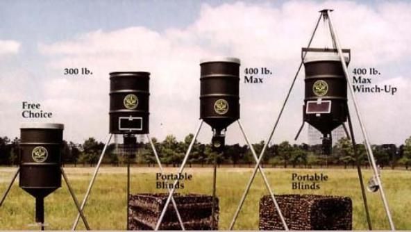 A row of barrels with smiley faces on them are lined up in a field