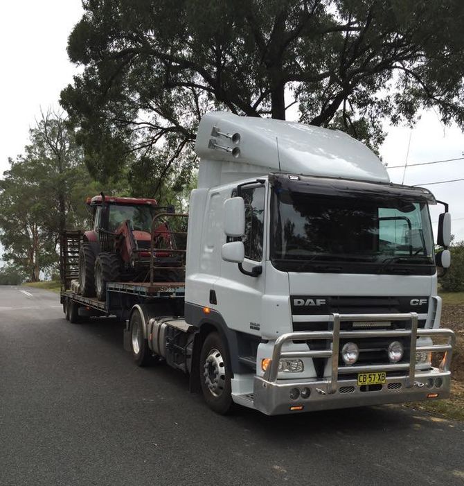 White Trailer Truck with a Tractor in Trailer | Sydney Nsw  | Agritract