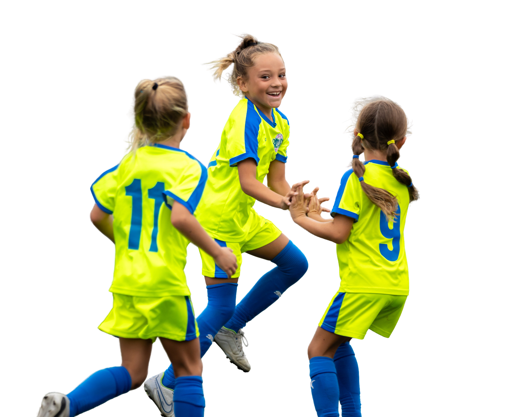 Three young SC Blues girls in yellow and blue soccer uniforms are jumping in the air.