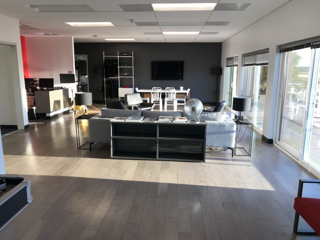 A living room with a lot of furniture and a flat screen tv