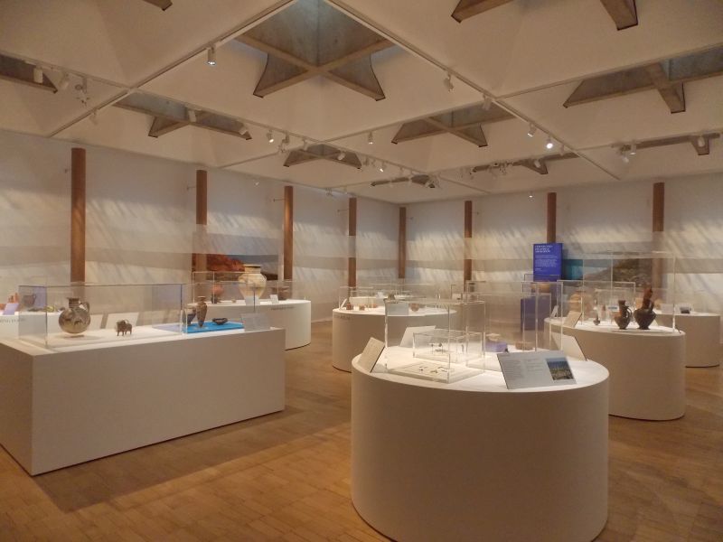 An artist 's impression of a museum with a lot of displays