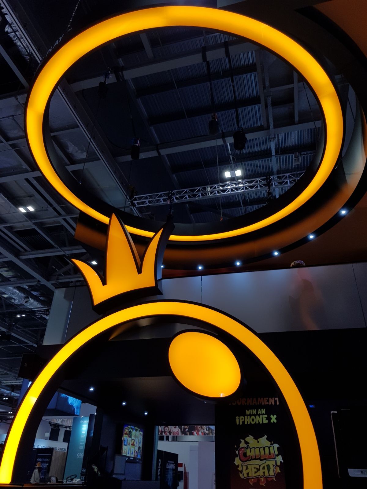 A crown is hanging from the ceiling of a building