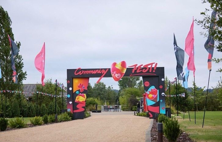 There is a sign that says community fest on it.