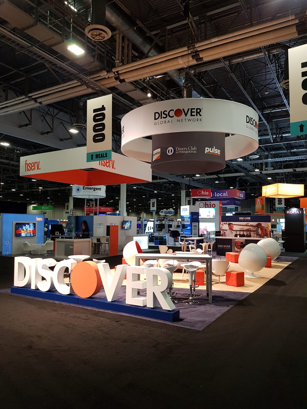 A large room with a sign that says discover