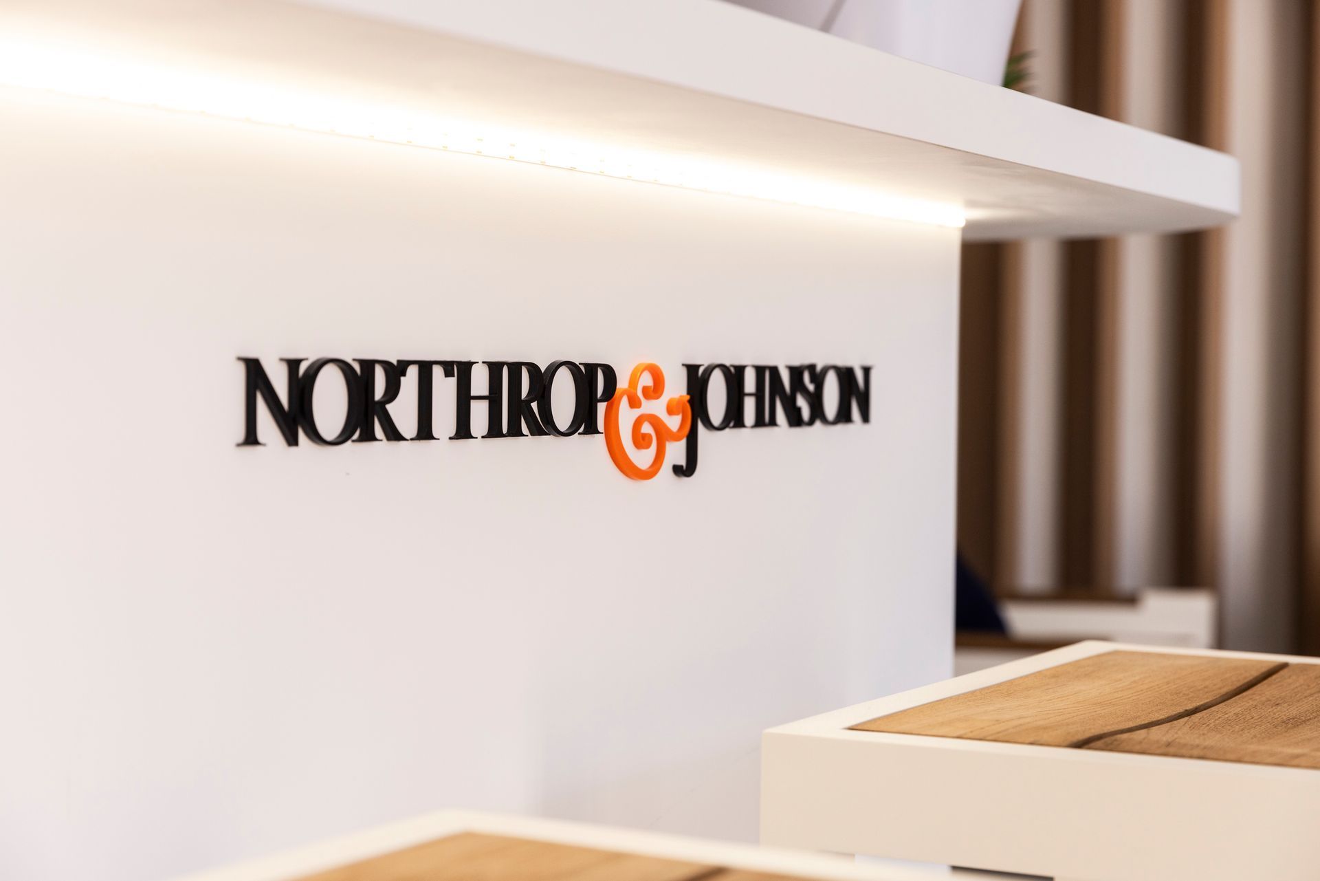 A white counter with the northrop & johnson logo on it