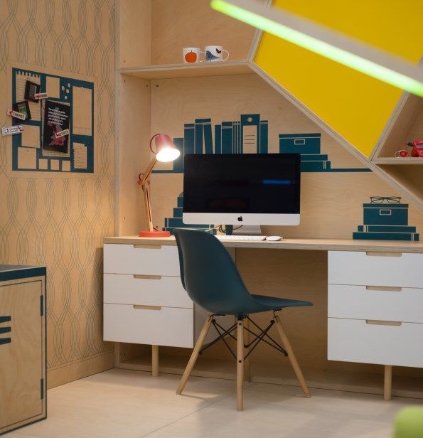 A desk with a computer on it and a chair