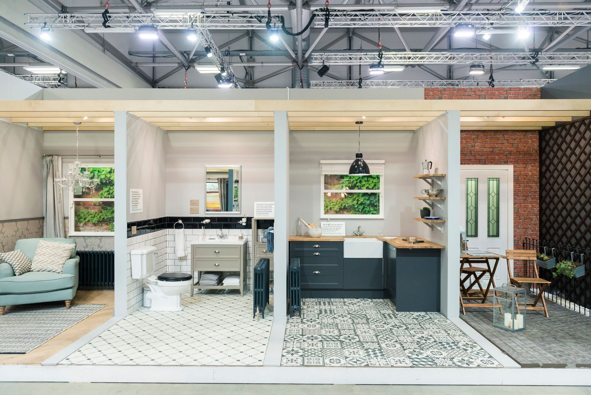 A cut in half of a house with a kitchen , bathroom and living room.