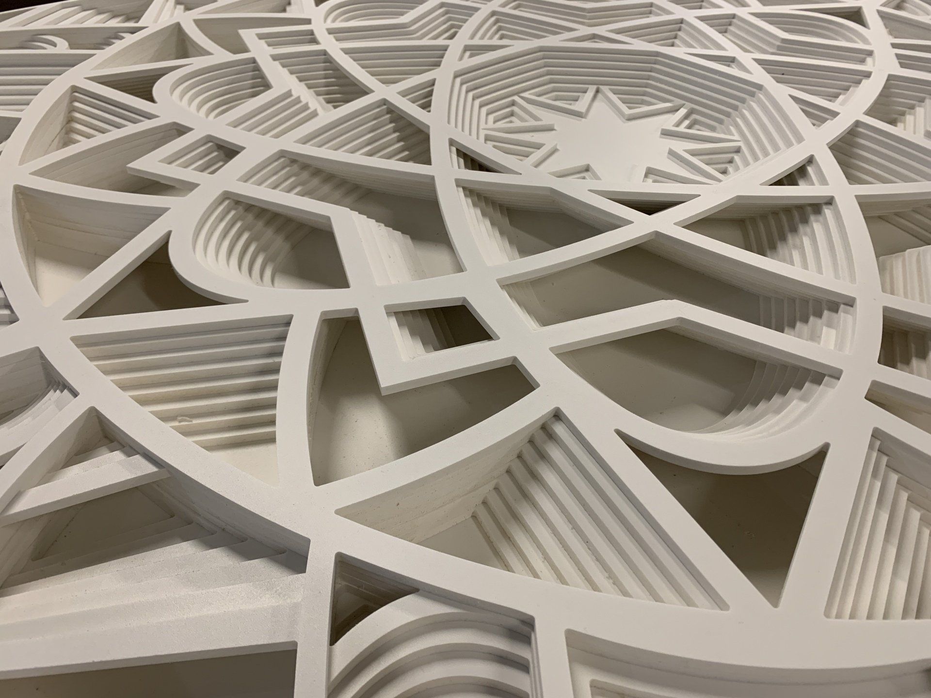 A close up of a white circular pattern on a table.