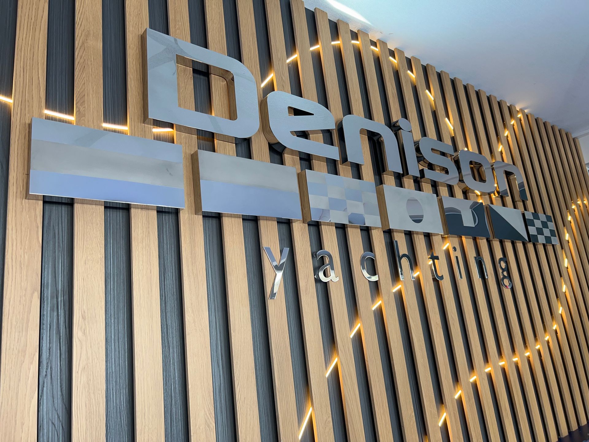 A wooden wall with the word denison on it