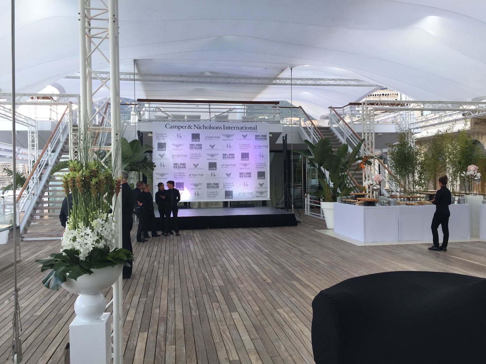 A large room with a large screen on the wall