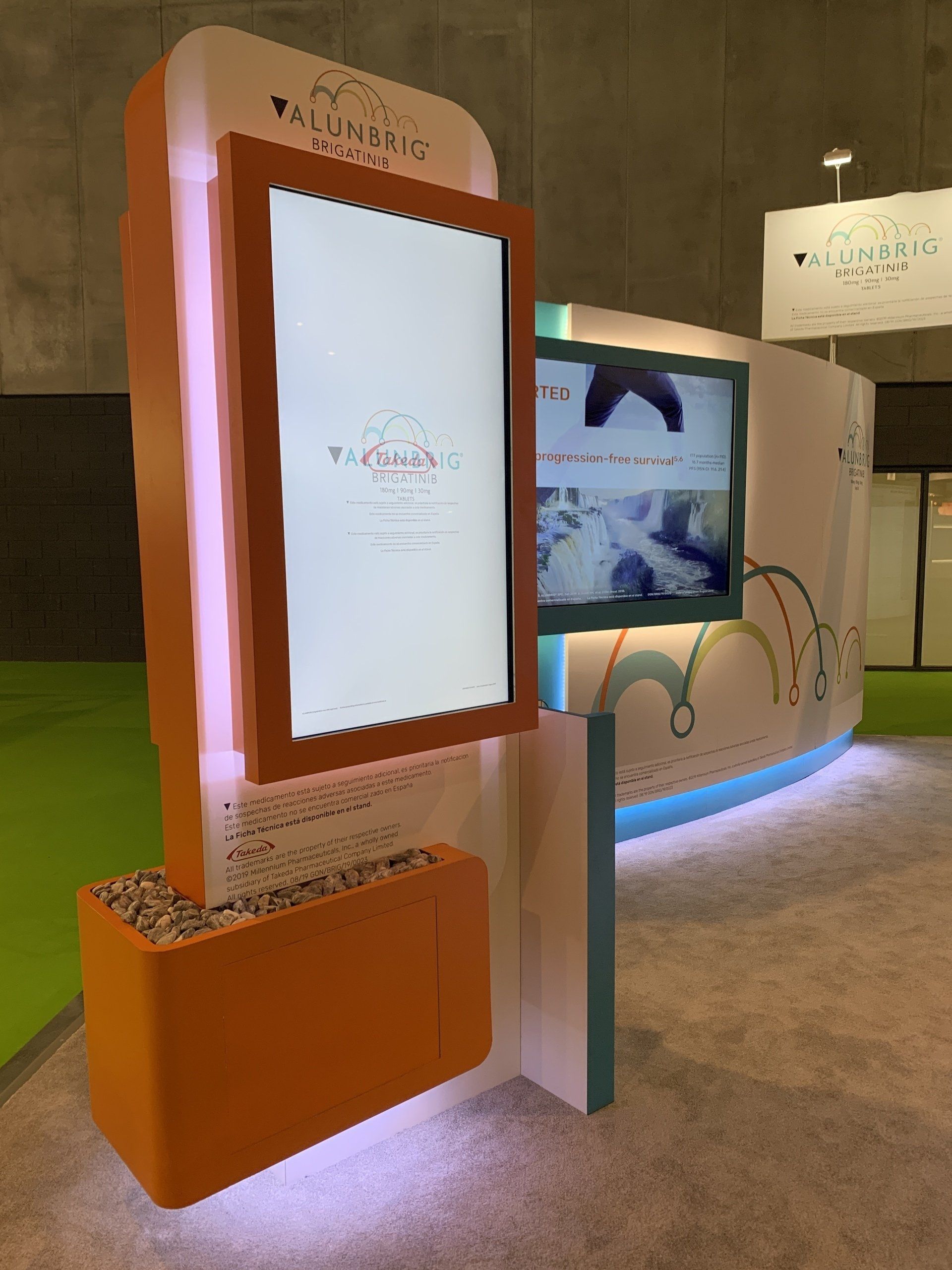 A large screen is sitting on a stand in a room.