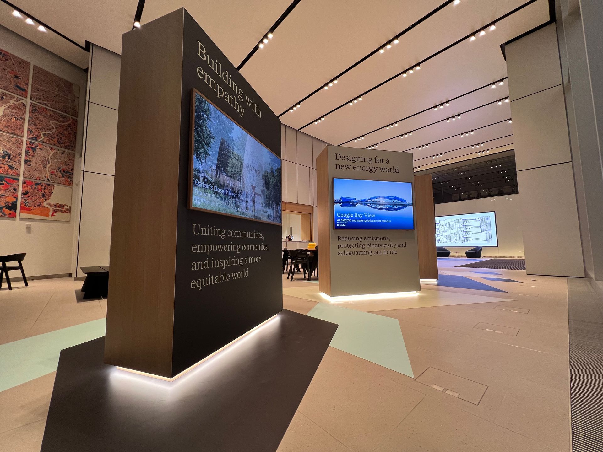 A large room with a large screen on the wall.