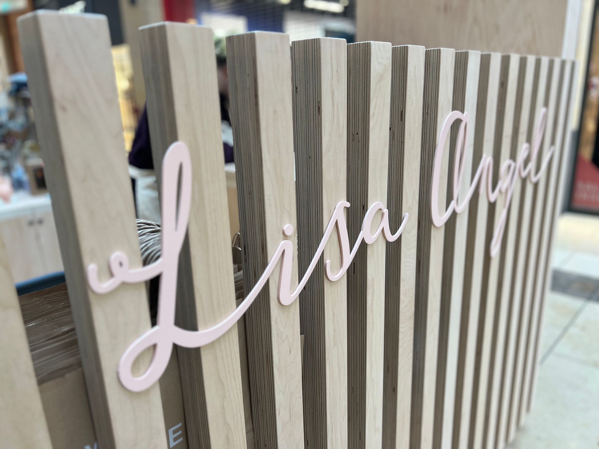 A wooden fence with the word lisa written on it.