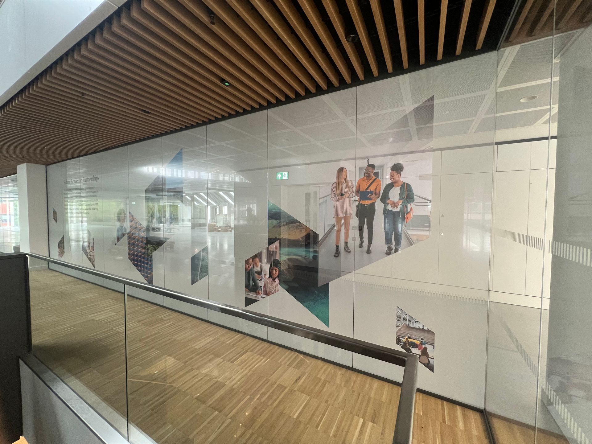 A glass wall with a picture of people on it
