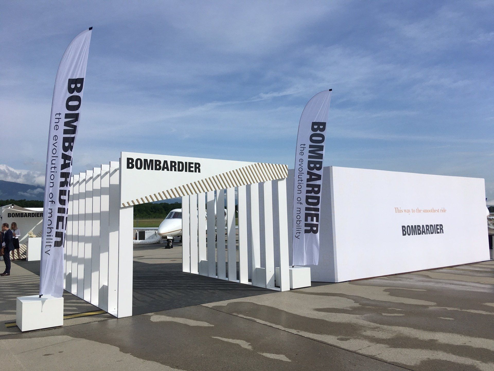 The word bombardier is on the white sign