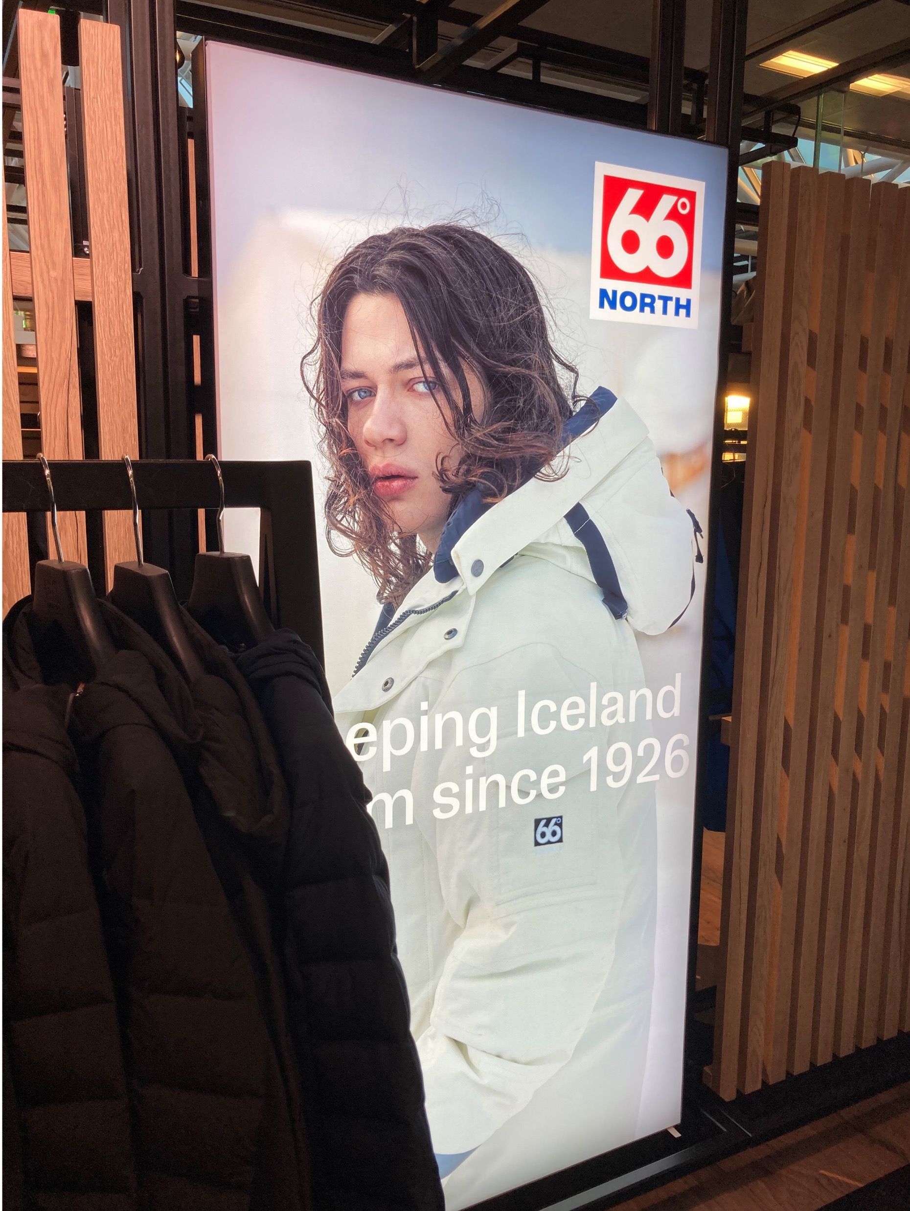 A poster of a man with the number 66 on it