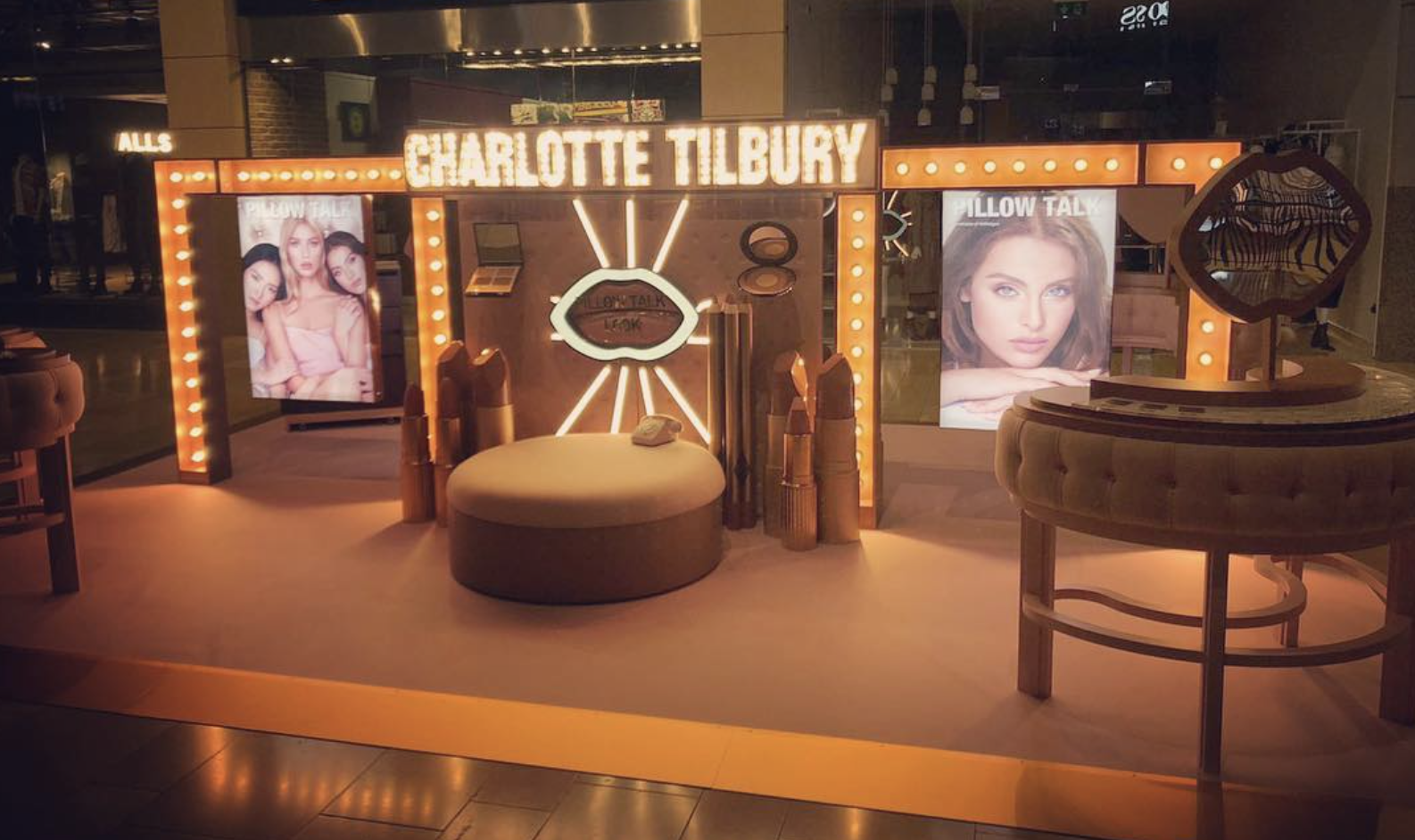 There is a sign that says charlotte tilbury on it.
