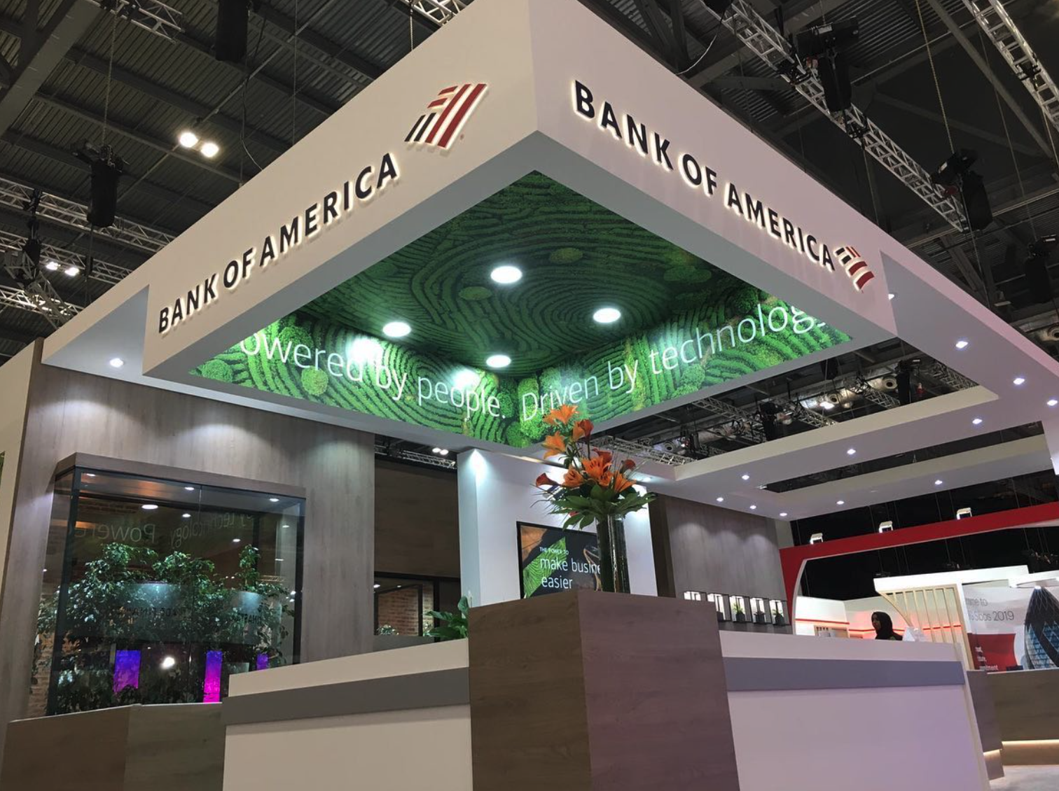 A bank of america booth with a green ceiling