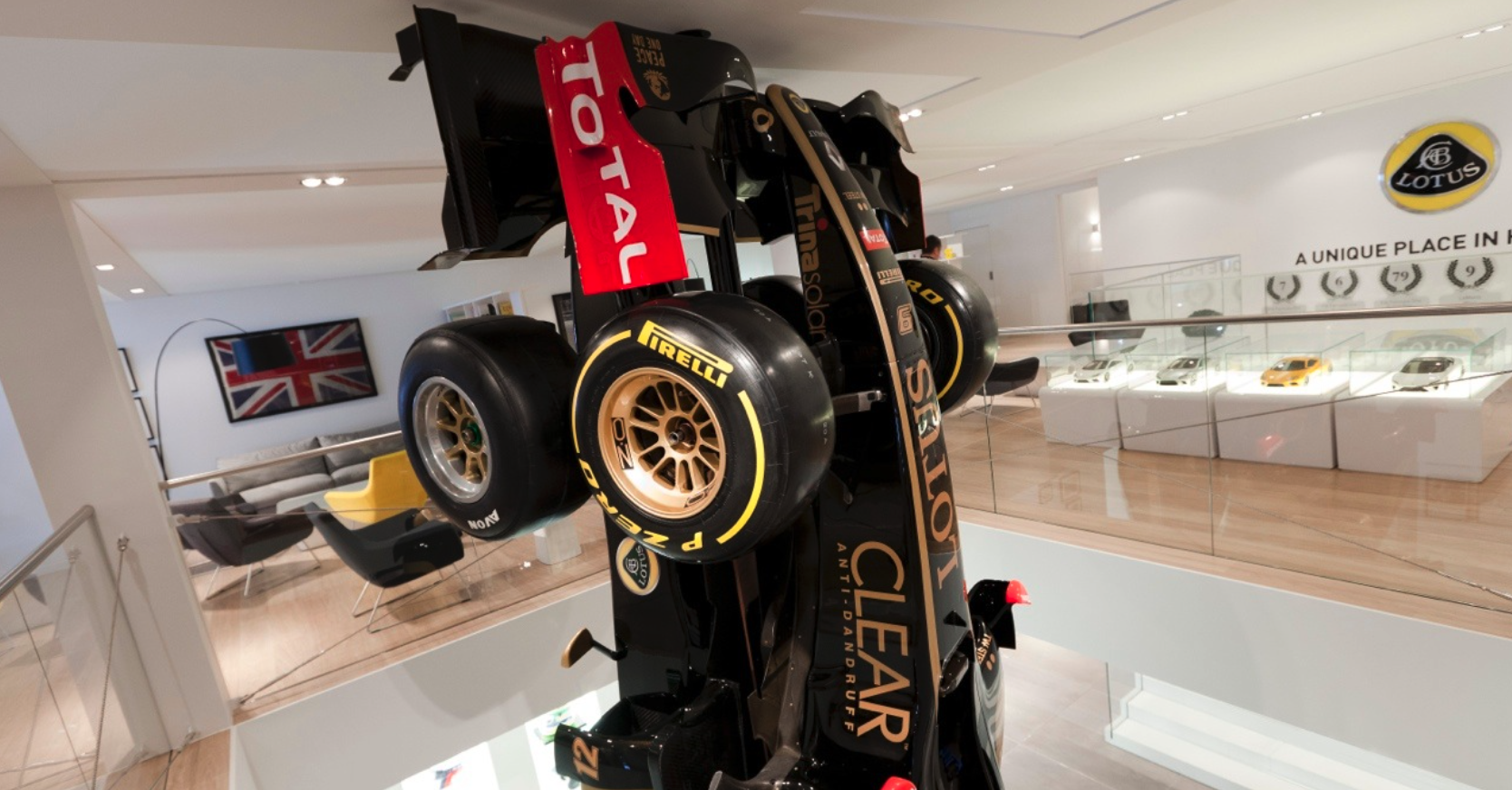 A race car is sitting on top of a table in a room.