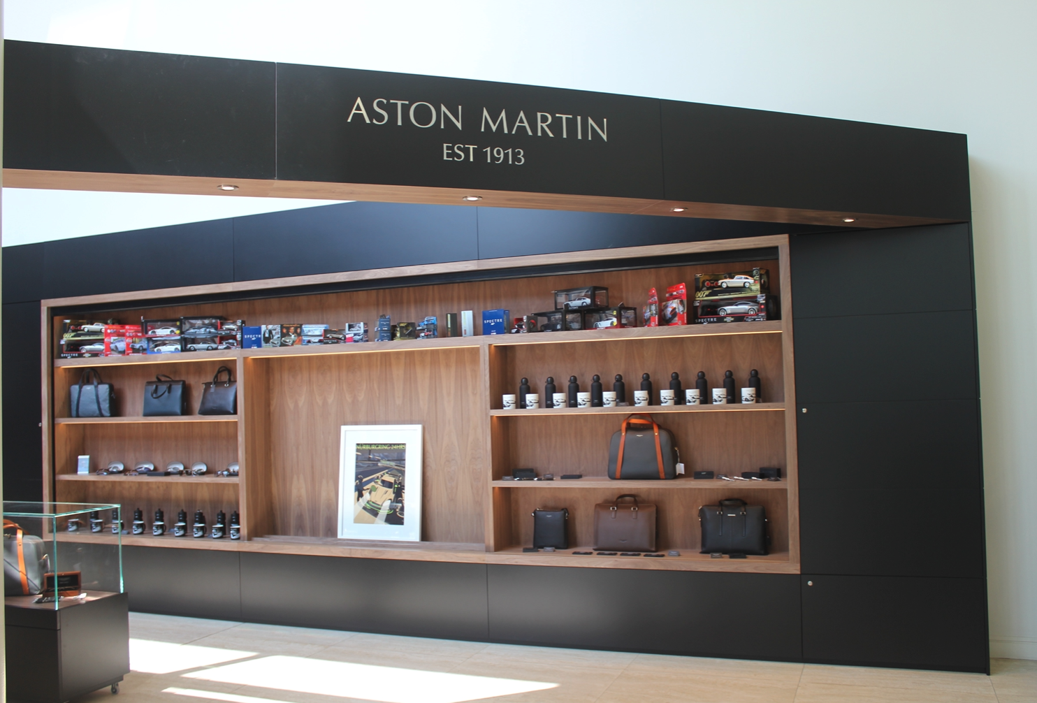 A store with a sign that says aston martin