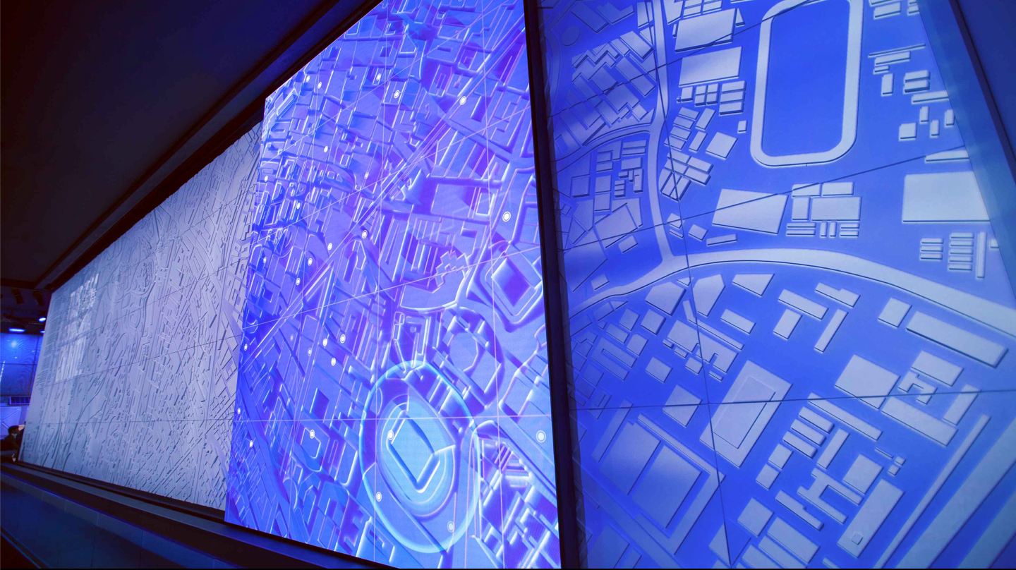 A large screen with a map of a city on it